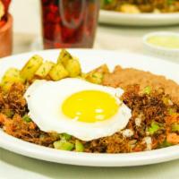 Machaca Ranchera With Eggs · Cooked with onions, tomatoes, and green peppers.