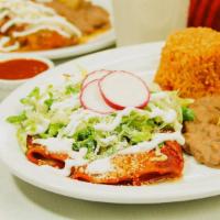 Enchiladas · Chicken or cheese enchiladas served with beans and rice.