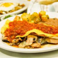 Mushroom & Cheese Omelet · Topped with salsa ranchera, served with refried beans and house potatoes.