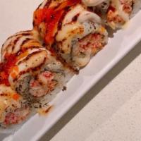 Domo Agitato Roll · Spicy tuna and crab mix topped with torched white fish, teriyaki sauce, white sauce, masago.