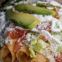 Tacos Dorados · 4 fried tortilla taquitos, Lettuce, Tomato, Sour cream, Powder cheese, Avocado.