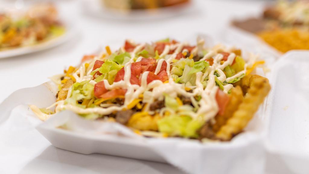 Loaded Fries · Pick your meat choice of Asada/Beef, Pollo/Chicken,  Carnitas/Pork, or Adovada de puerco/ Pork mix. Topped with tomato, onion, cilantro, cheddar jack cheese , and sour cream