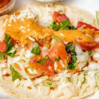 Tacos De Pescado · Cabbage, cilantro, onions, tomato, & chipotle sauce.
Salsa on the side.