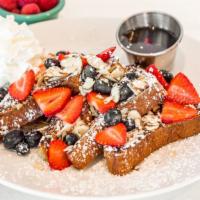 French Toast · Two brioche French toast served with fresh berries, diced raw almonds and maple syrup.