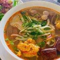 S2 - Bún Bò Huế - Spicy Beef Noodle · House special Spicy beef noodle soup.
Rice noodle, beef and pork slices, beef tendon, and po...
