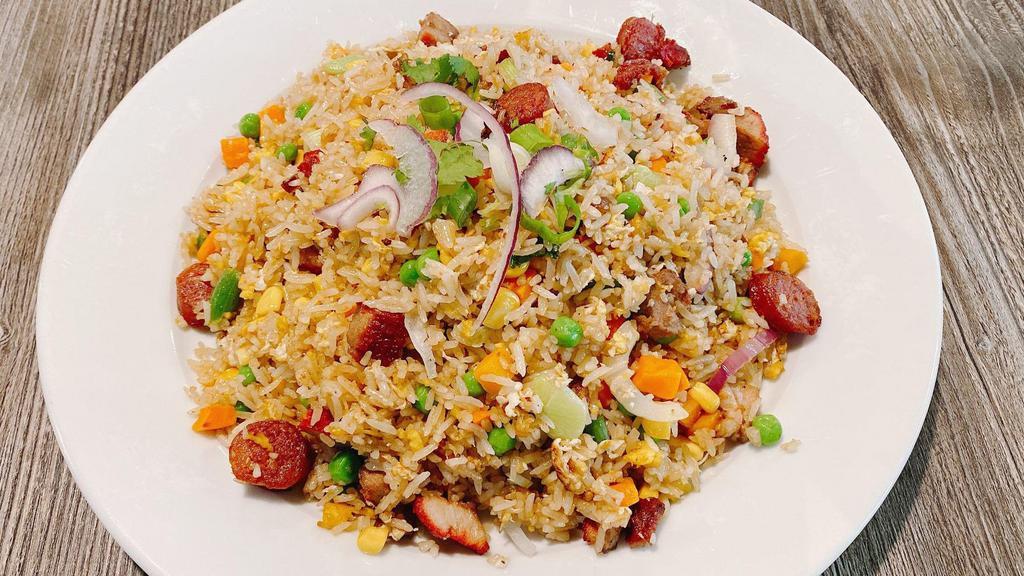 Creasian Fried Rice With Choice Of Meat · Fried rice with egg, peas, carrot, and onion with choice of meat.