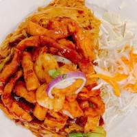 Pad Thai · Rice noodle with cabbage, egg, carrot, chicken, shrimp, and tofu in sweet and sour sauce top...
