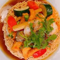 Bird'S Nest / Mì Xào Giòn · Crispy egg noodle topped with sautéed vegetable, onion, chicken, and shrimp in gravy.