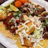 Tacos Chilangos · 3 tacos with marinated Asada in salsa de chile de Arbol and topped with onion cilantro mix. ...