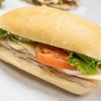 Deli Turkey Sandwich · Turkey, Swiss cheese, Lettuce, Tomato, Pickle, Olive, Wax peppers, Mayo and mustard