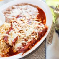#4. 2 Beef Enchiladas Rice/Beans · Beef,chicken or cheese :served with Rice & beans wet with enchilada sause.
