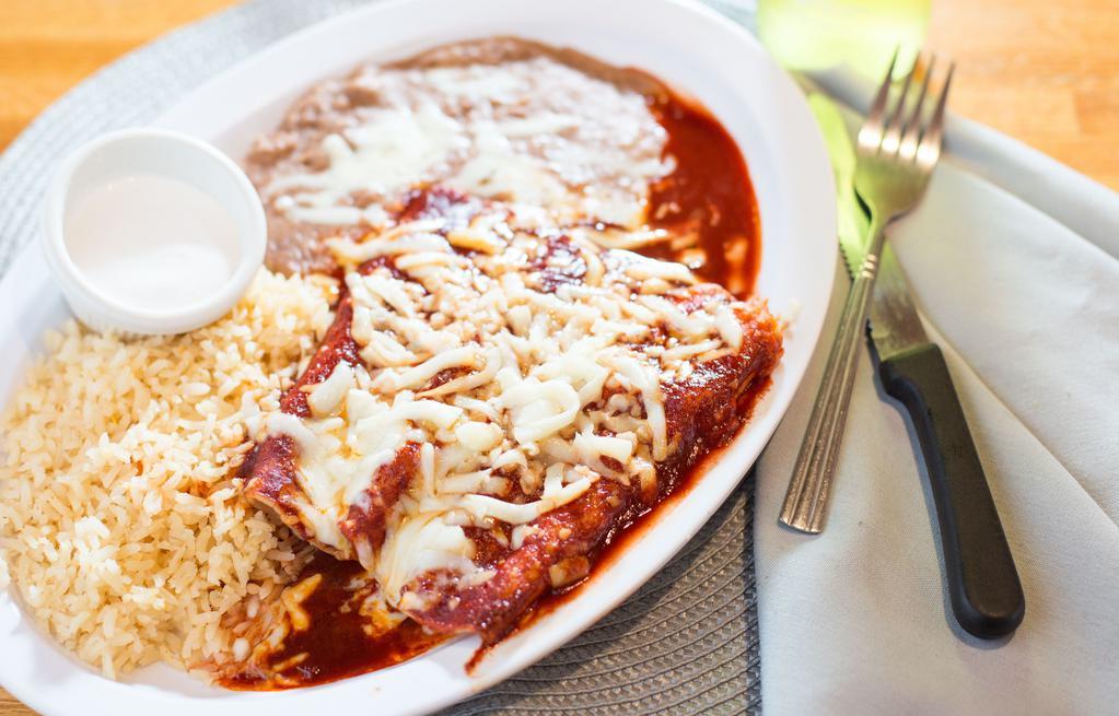 #4. 2 Beef Enchiladas Rice/Beans · Beef,chicken or cheese :served with Rice & beans wet with enchilada sause.