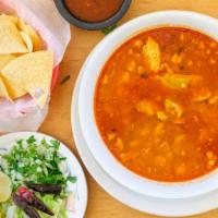 Pozole · Pork soup with corn hominy and tos.
