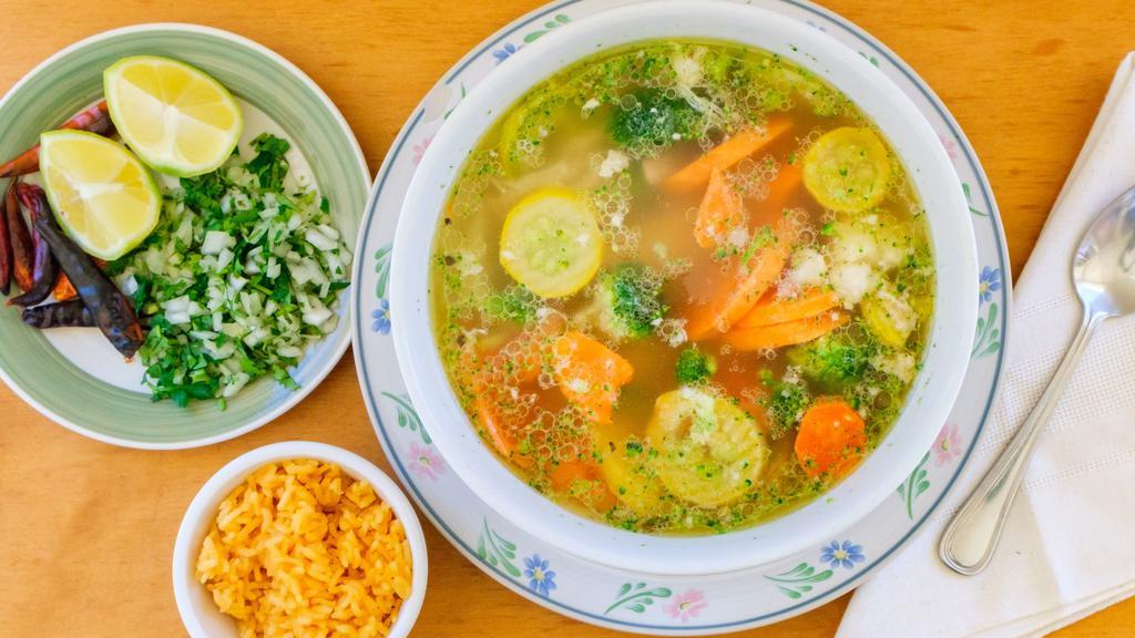 Caldo De Pollo & Tortillas · Chicken soup with veggies and rice.