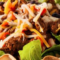 Taco Salad · Mixed field greens, roasted corn, garbanzo beans, carrot, tomato, red onion, pico de gallo, ...