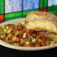 Sausage And Egg Ciabatta · Grilled Ciabatta and grilled sausage patty and two eggs, topped with American cheese. Hash b...