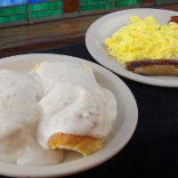 U-All · Two large buttermilk biscuits smothered in country gravy with three eggs and choice of meat