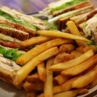 Club House · Toasted triple-decker sandwich loaded with turkey, bacon, lettuce and tomato. Served with fr...