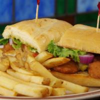 Fried Chicken Sandwich · Chicken strips golden fried served on our soft steak roll with lettuce, tomato, sweet red on...