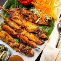 Satay
 · Grilled chicken marinated in coconut milk and a medley of spices served on a skewer with pea...