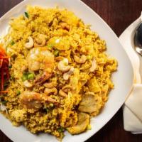 Pineapple Fried Rice
 · Thai fried rice with eggs, chicken, shrimp, tomato, onion, cashew nut and pineapple with cur...