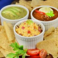 Trio Of Dips · house-made roasted red salsa, guacamole, pimento cheese, house tortilla chips (NO MODIFICATI...