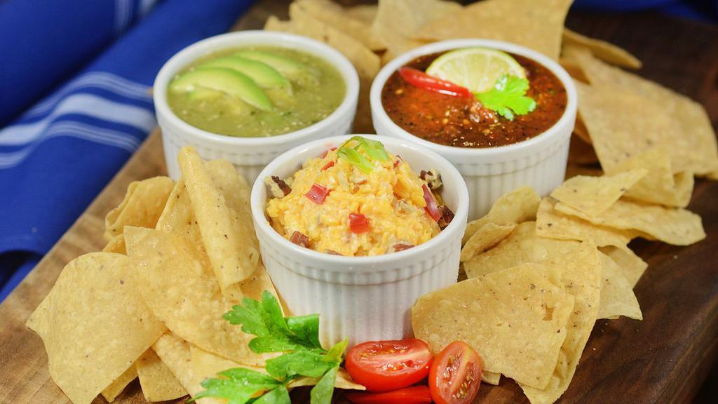 Trio Of Dips · house-made roasted red salsa, guacamole, pimento cheese, house tortilla chips (NO MODIFICATIONS ACCEPTED) | gff | v | n
