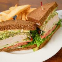 Turkey Avocado Sandwich · Thinly sliced breast of turkey and ripe avocado with lettuce, tomato, cucumber slices and al...