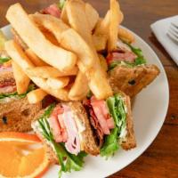 Club Sandwich · Slices of ham, bacon, cheese, tomato, lettuce. Served on whole grain bread.