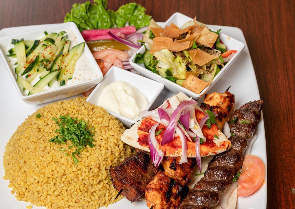 Mixed Grilled | 3 Skewers · Beef, chicken and kafta, seasoned to perfection. served with your choose of Rice, French Fries  or bulgur with 2 cold appetizers of your choice.