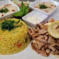 Chicken Shawarma Plate · Marinated and flame-broiled chicken, thin cut. served with your choose of Rice, French Fries...