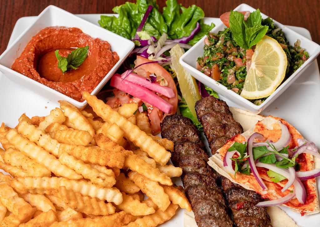 Kafta Kabob | 2 Skewers · Ground beef and lamb mixed with parsley and onion, seasoned to perfection. served with your choose of Rice, French Fries  or bulgur with 2 cold appetizers of your choice.