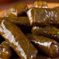 Yolanche | 4 Pcs · Grape leaves, stuffed with rice, parsley, onion, tomatoes and lemon juice.