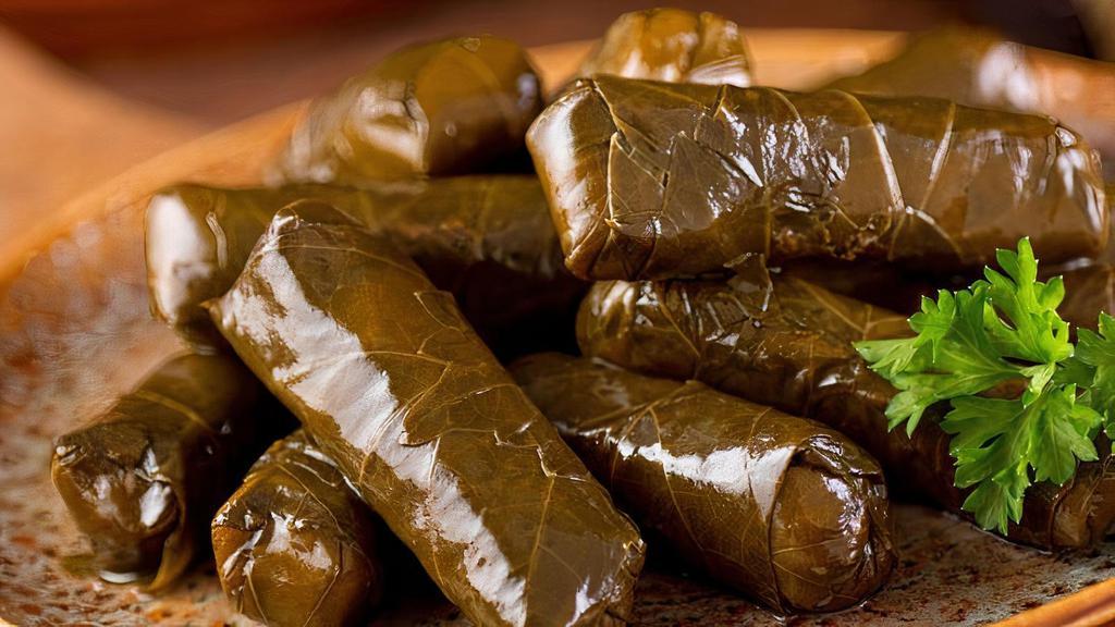 Yolanche | 4 Pcs · Grape leaves, stuffed with rice, parsley, onion, tomatoes and lemon juice.