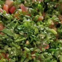 Tabbouleh · Finely chopped parsley, bulghur wheat, diced tomatoes and onions, dressed with olive oil and...