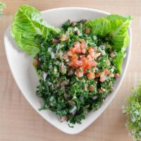 Tabbouleh Salad · Parsley, tomatoes, mint, green onions, bulgur seasoned with lemon juice, salt, and pepper.