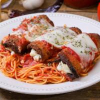 Eggplant Parmigiana · Breaded eggplant served with spaghetti, marinara sauce, and mozzarella cheese. Served with a...
