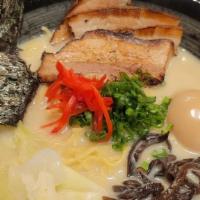Tonkotsu Ramen · Rich pork broth, BBQ pork, soft boiled marinated egg, nori, ginger, fungus, green onion, cab...