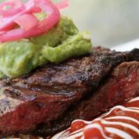 Steak Tampiquena · Hand-cut Angus steak, red salsa espanola, two cheese enchiladas, pickled onion, guacamole, s...