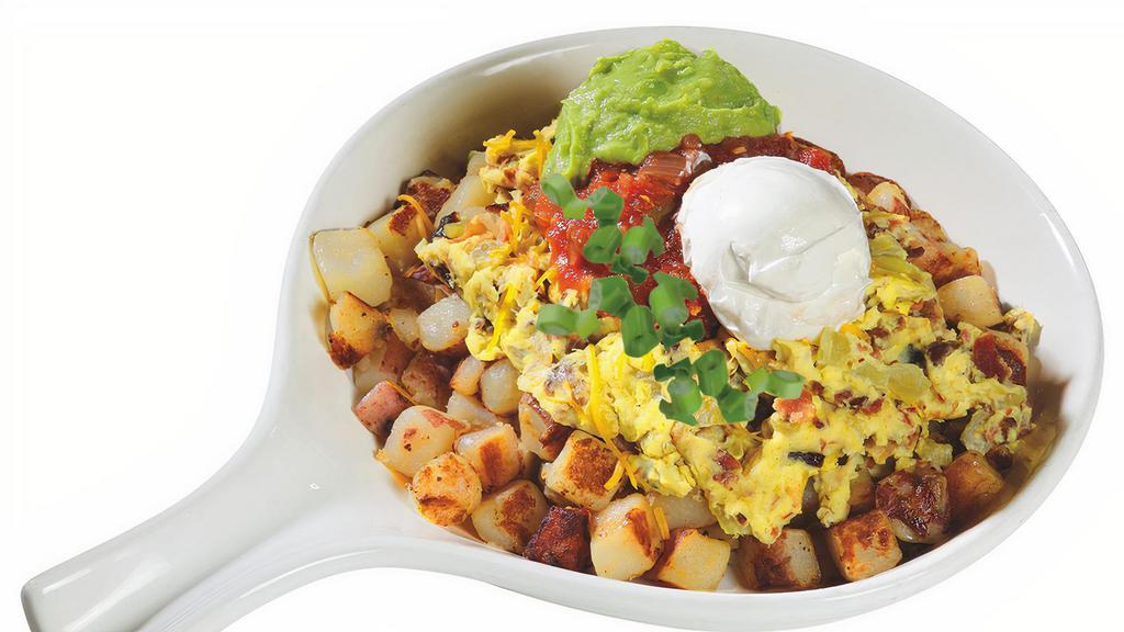 Santa Fe Skillet · Lumberjacks signature items. Bacon, cheddar cheese and diced green chilies, served over our country potatoes and scrambled eggs then topped with salsa, guacamole, green onions and sour cream.