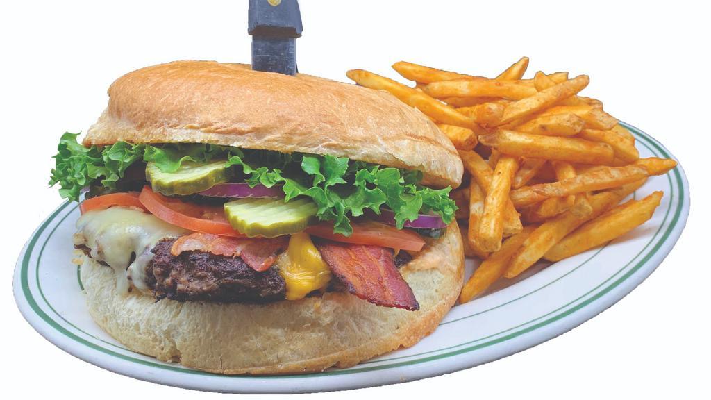 The 1 Pound Redwood Burger · Lumberjacks signature items. The biggest burger around. One full pound burger with swiss and American cheese, topped off with three strips of bacon, lettuce, tomato, red onions, pickles and our special dressing on a grilled bun.