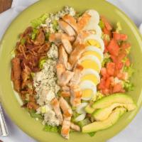 Cobb Salad · Fresh chopped romaine lettuce, crispy bacon, char-broiled chicken breast, crumbled blue chee...
