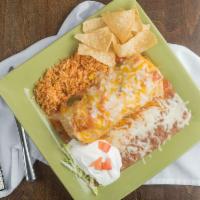 Burrito Ranchero · Grande burrito – smothered in our salsa ranchero and melted cheese, served with black or pin...