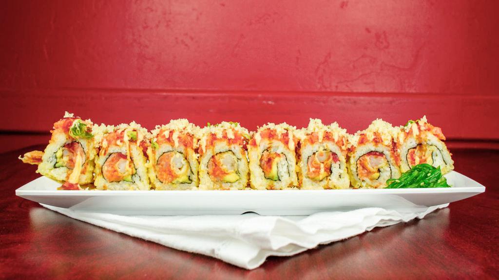 Golden Tiger Roll · Shrimp tempura, spicy albacore, avocado, and sweet radish, lightly fried then topped with spicy tuna, crunch, masago, spicy mayo, and eel sauce.