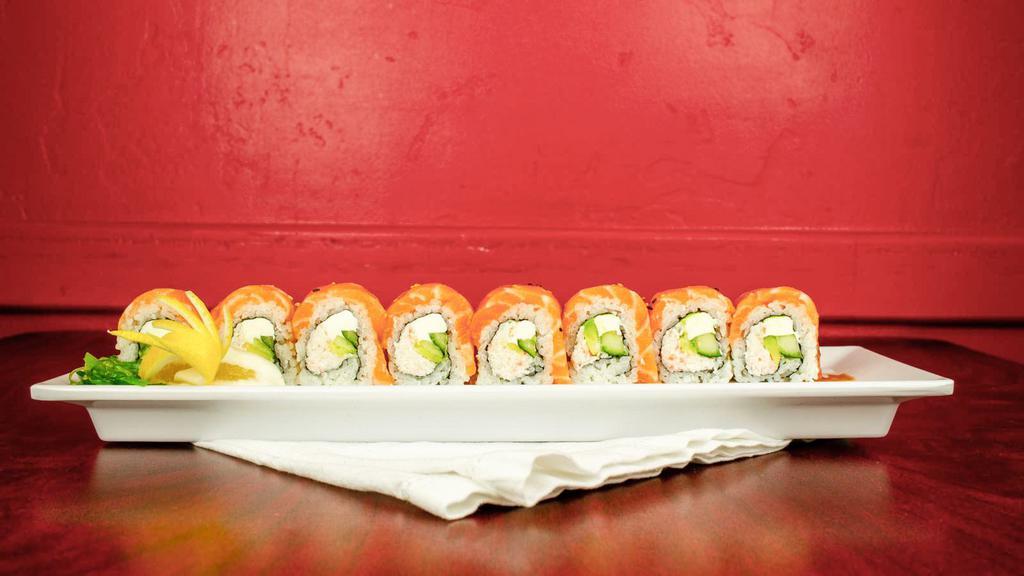 Alaskan Roll · Crab meat cream cheese, avocado, and cucumber, topped with fresh salmon. Served with mustard sauce.