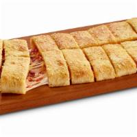Bacon Stuffed Howie Bread® · 16 bread sticks stuffed with mozzarella, cheddar & bacon, topped with garlic herb seasoning ...