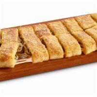 Jalapeño Stuffed Howie Bread · 16 bread sticks stuffed with mozzarella, cheddar & jalapeño, topped with garlic herb seasoni...