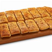 Cajun Howie Bread · 16 pieces hot buttered bread sticks sprinkled with cajun seasonings, served with a side of z...