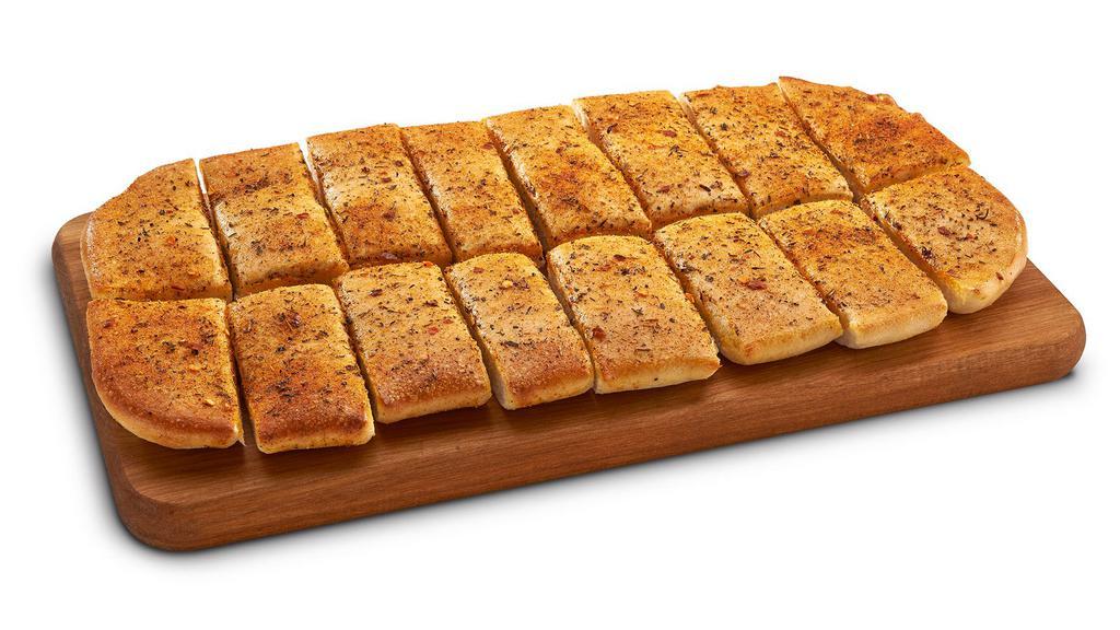 Howie Bread (16 Pc) · Hot, buttered garlic bread sticks topped with parmesan cheese, served with pizza sauce for dipping. 70 Per Pc cal.