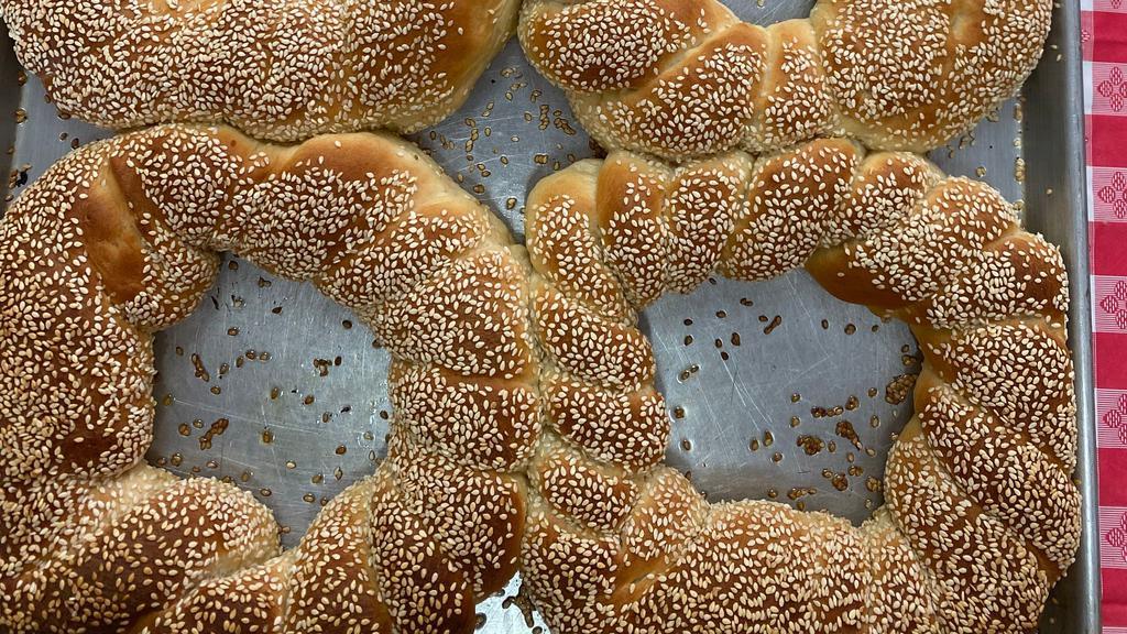 Jerusalem Bagel · Kaak also known as street bread . Fluffy bread with golden sesame seeds on top with a hit of sweetness.